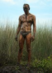 muddy man in bikini briefs