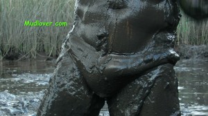 man in muddy bikini