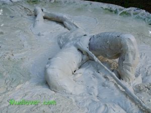 Still image from a clay pit bondage video on July 5, 2026.
